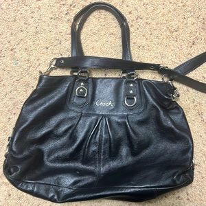 Black Coach purple lining.